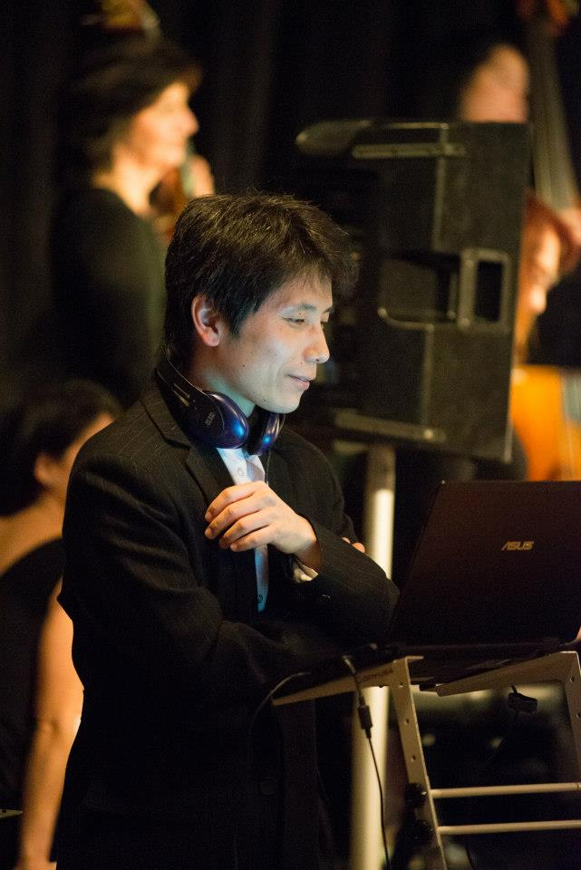Rick Kim selecting music at the DJ table
